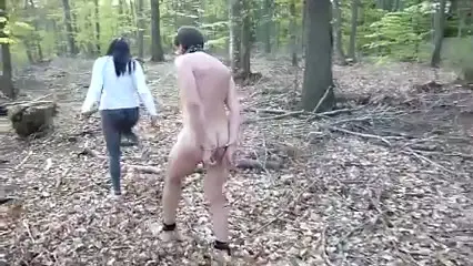 Mistress takes a stroll with nude slave in forest BDSM - BDSM.one